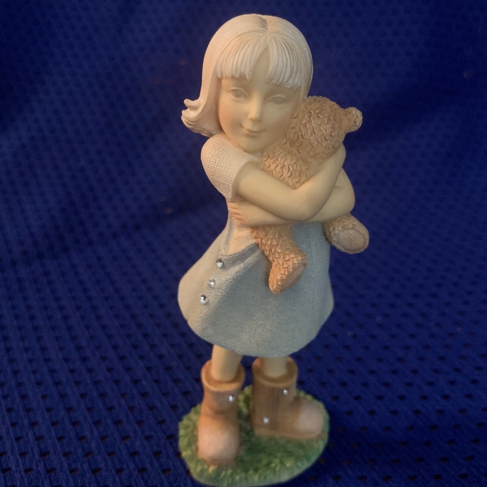 Girl With Teddy Bear figurine.